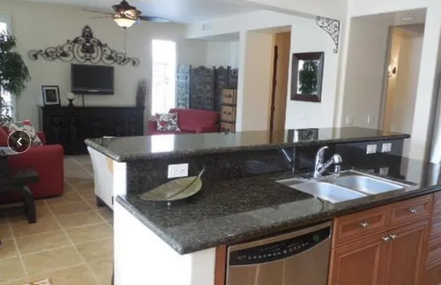 a kitchen with a sink and cabinets