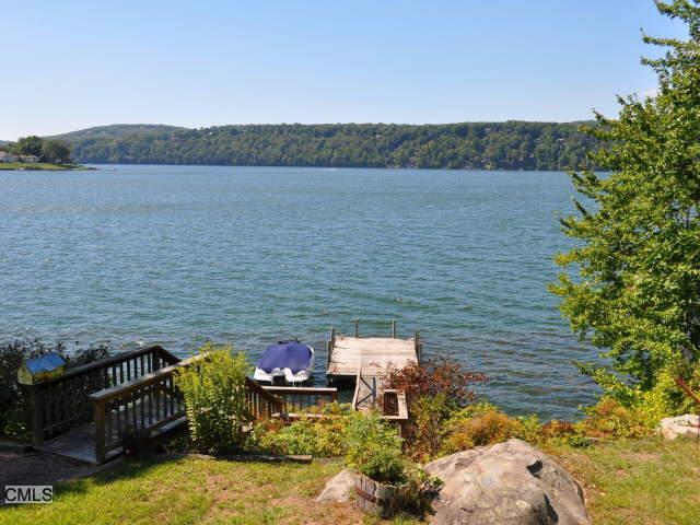 38 Indian Trail Brookfield, CT 06804 - Photo 1 of 1 a backyard of a house with lots of green space and mountain view in back