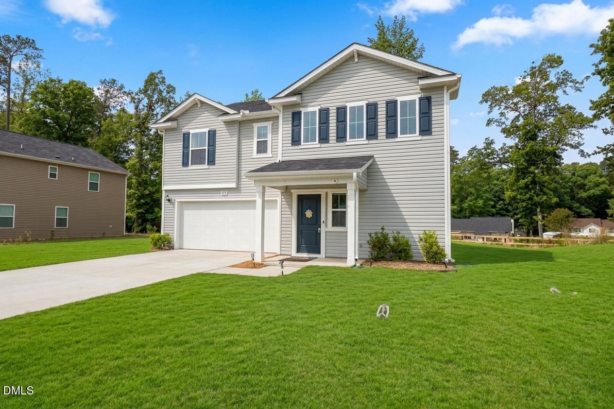 177 Yellowwood Avenue Spring Hope, NC 27882 - Photo 1 of 31 a front view of a house with a yard and trees
