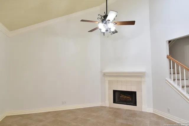 a view of an empty room with a fireplace