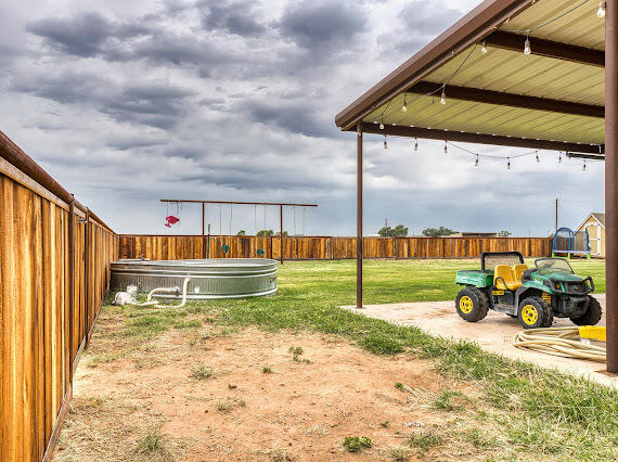 6341 Farm Private Road Levelland, TX 79336 - Photo 38 of 46 a view of a backyard with wooden fence