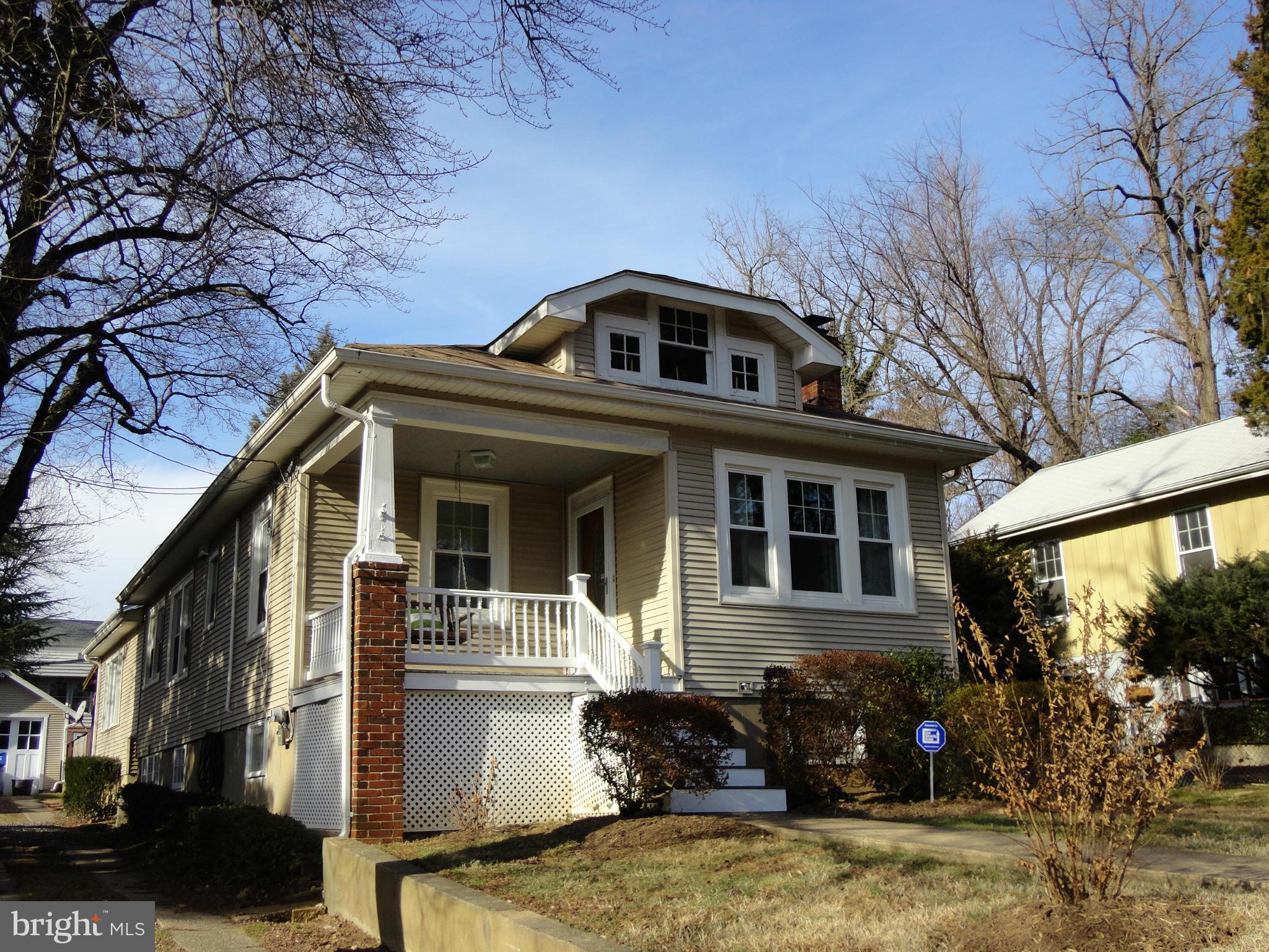 1919 Grace Church Road Silver Spring, MD 20910 - Photo 3 of 23 a front view of a house with a yard