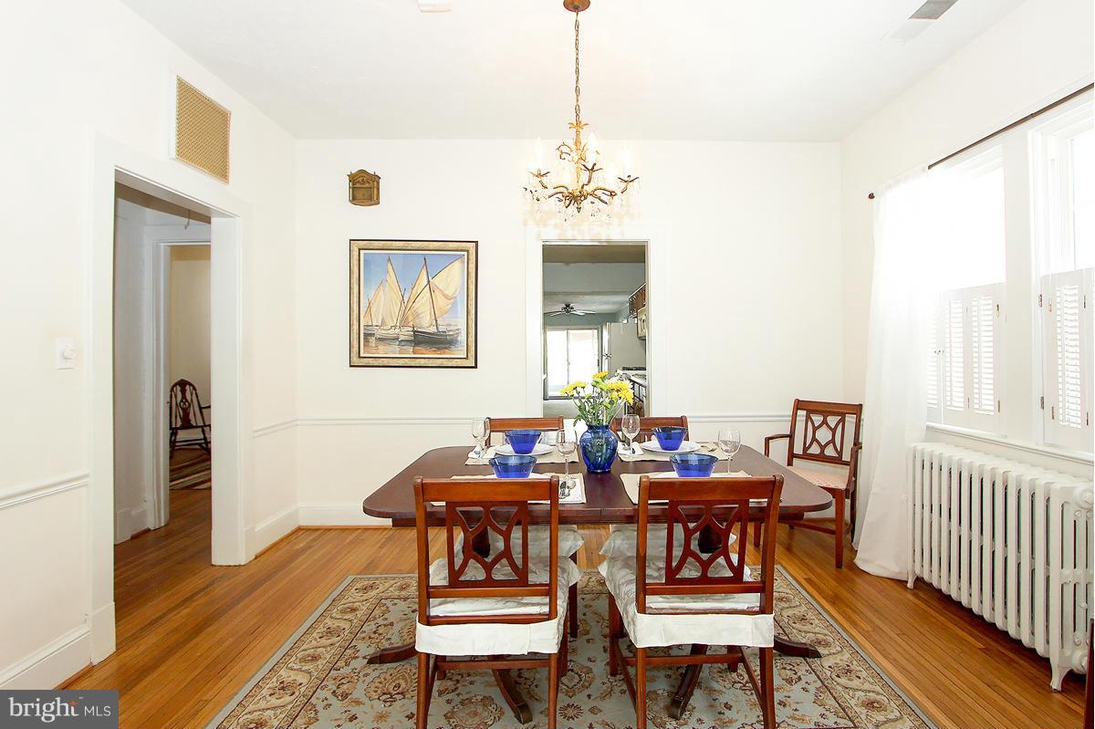 1919 Grace Church Road Silver Spring, MD 20910 - Photo 8 of 23 a view of a dining room with furniture window and wooden floor