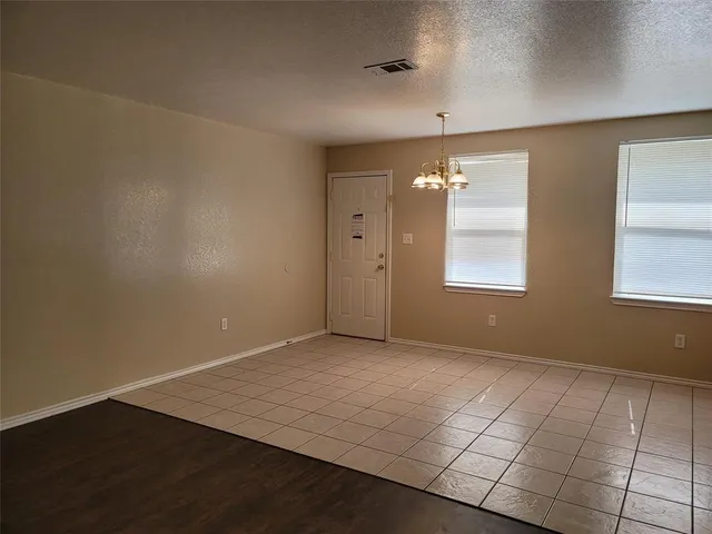 a large kitchen with stainless steel appliances granite countertop a sink and cabinets