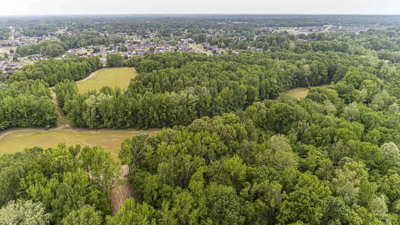 Meade Lake Road Atoka, TN 38004 - Photo 5 of 12 Aerial view of property and surrounding area featuring a heavily wooded area