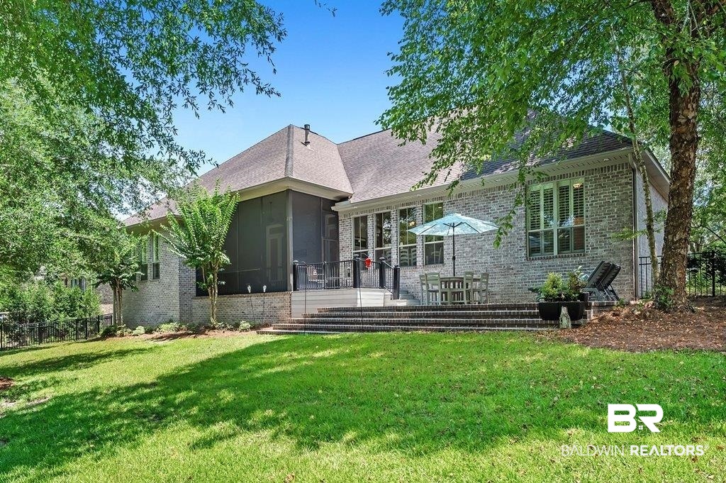 30014 Dolive Ridge Daphne, AL 36527 - Photo 54 of 57 Rear view of house with a yard and a sunroom