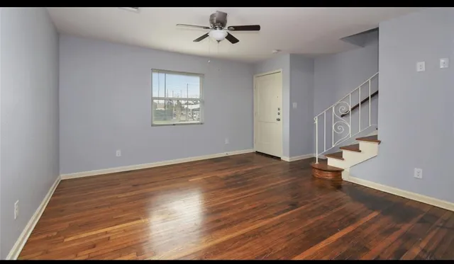 a view of an entryway with wooden floor