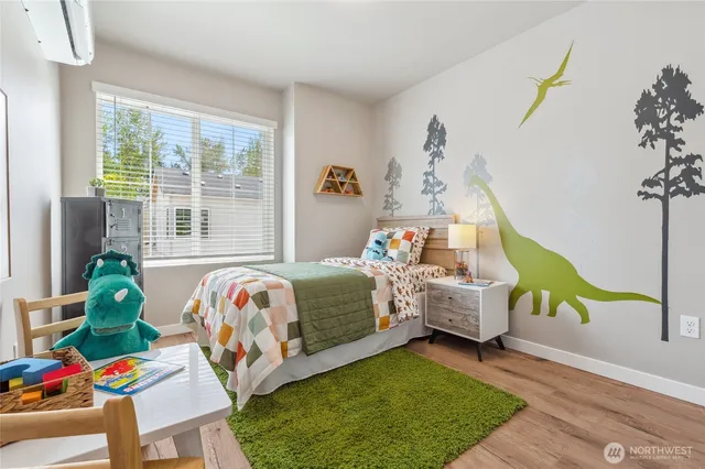 a bedroom with a bed and a window