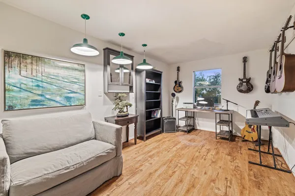 a living room with furniture and a large window