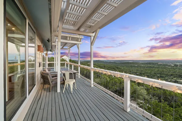 a view of a balcony with chairs