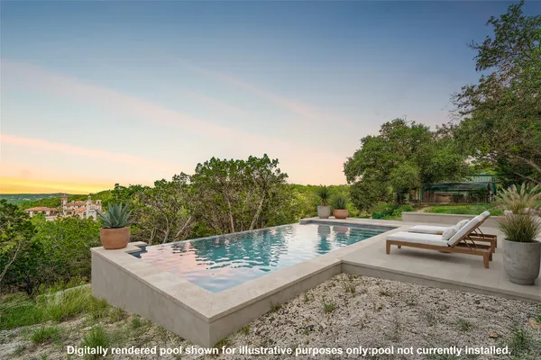 a view of a swimming pool with a patio