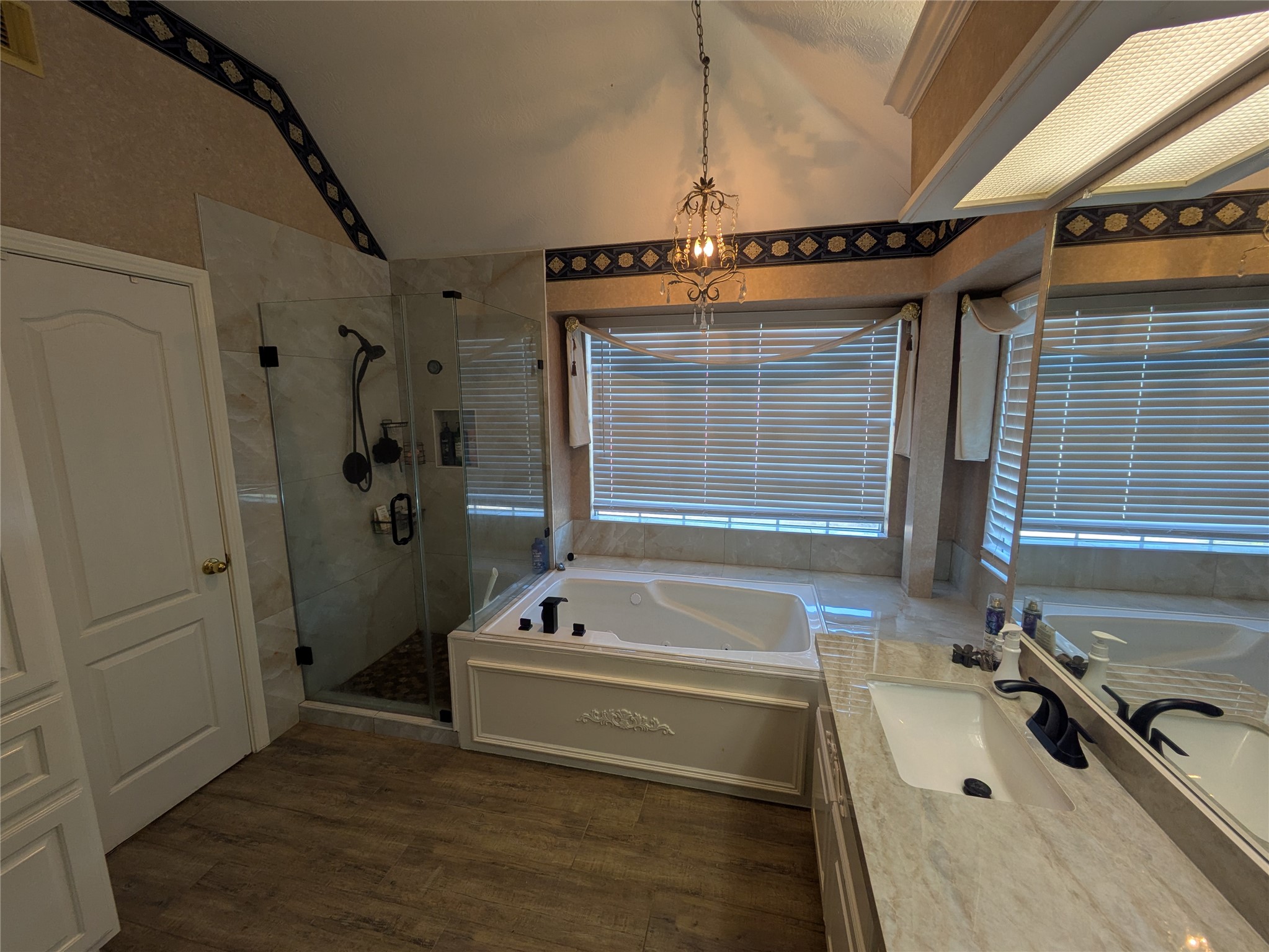 9222 Symphonic Lane Houston, TX 77040 - Photo 10 of 33 Recently Remodelled Master Bath with Taj Mahal Porcelien Vanity and all glass shower.
