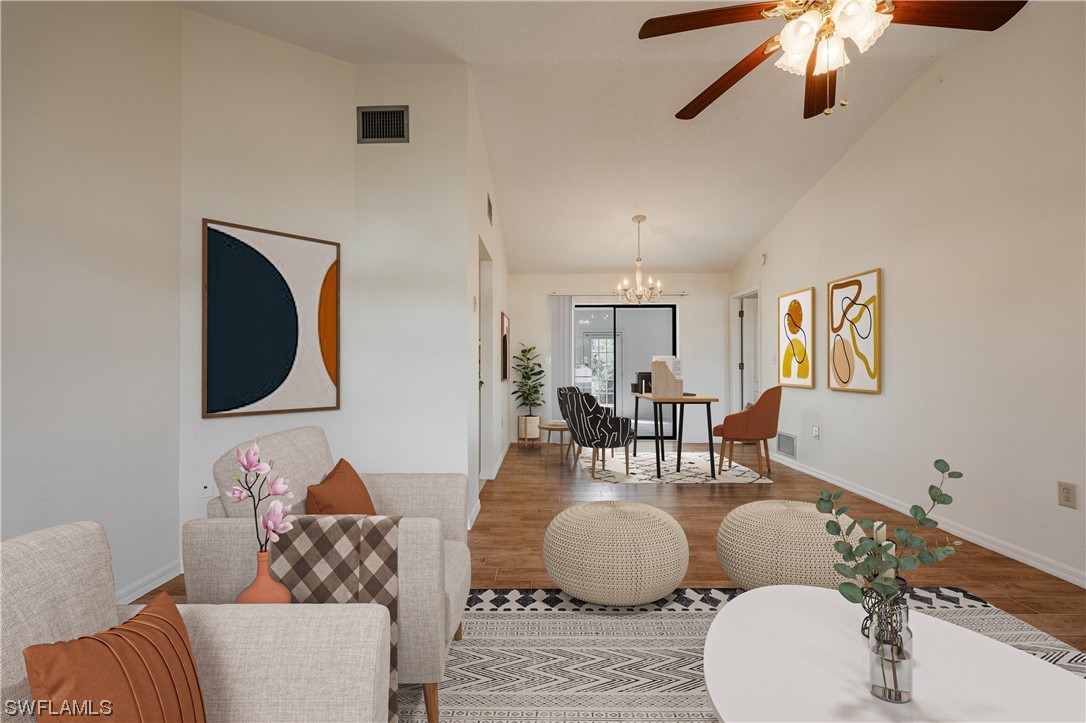 1437 Alton Road Port Charlotte, FL 33952 - Photo 8 of 40 a living room with furniture and a wooden floor