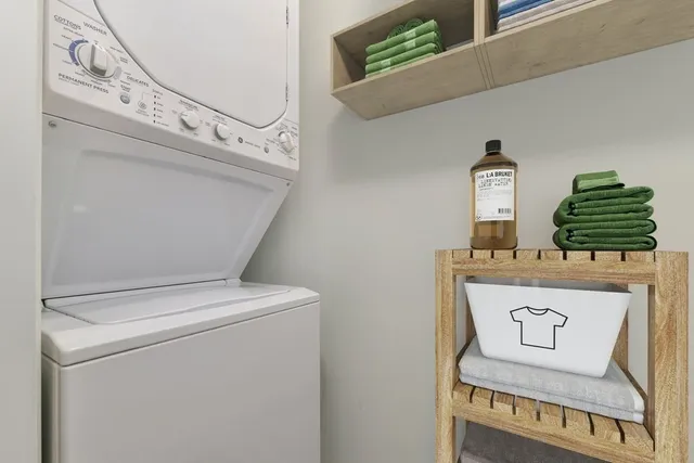 a balcony with table and chairs