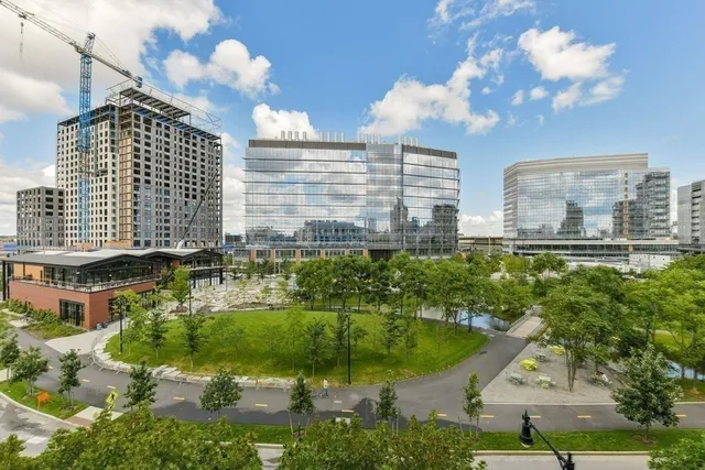 a front view of a building with sitting area