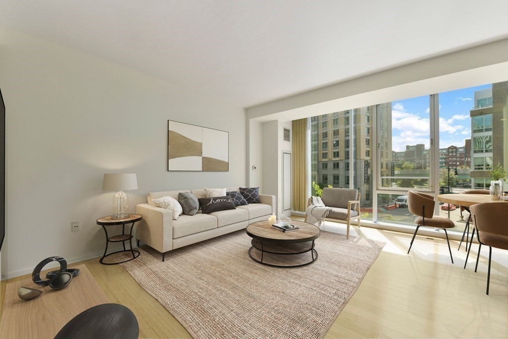 2 Earhart Street, Unit 324 Cambridge, MA 02141 - Photo 4 of 42 a living room with furniture and a large window