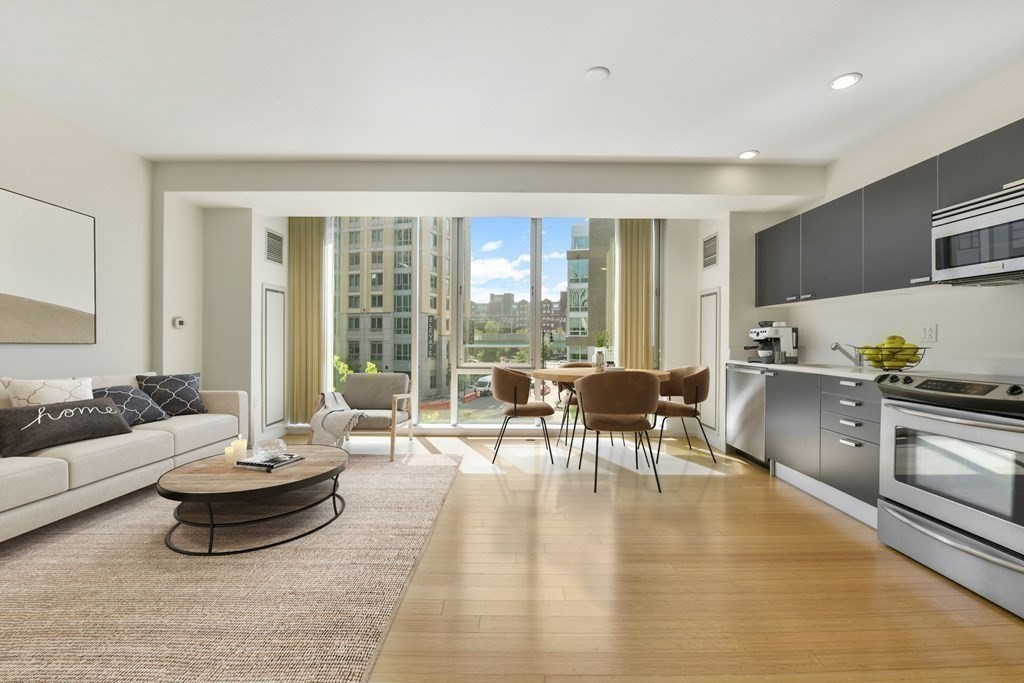 2 Earhart Street, Unit 324 Cambridge, MA 02141 - Photo 5 of 42 a living room with furniture and a large window