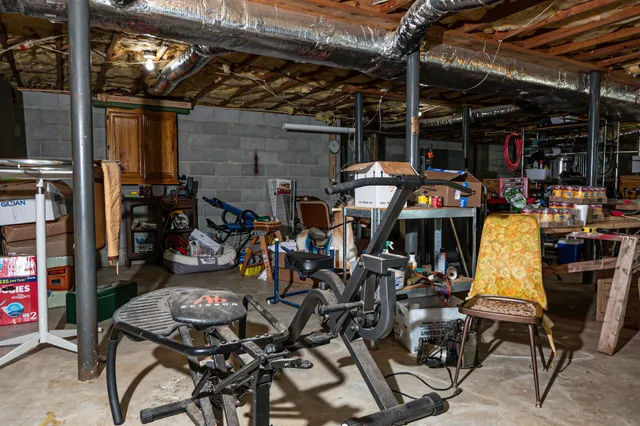 a view of an chairs and table in a room