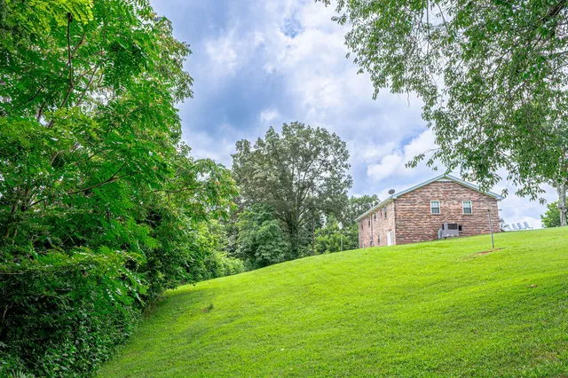 a view of a garden with a building in the background