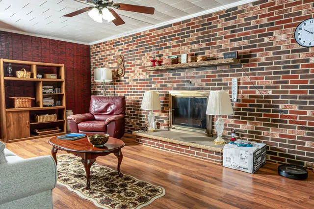 a living room with furniture and a fireplace