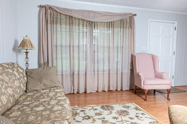 a bedroom with a bed and a chair