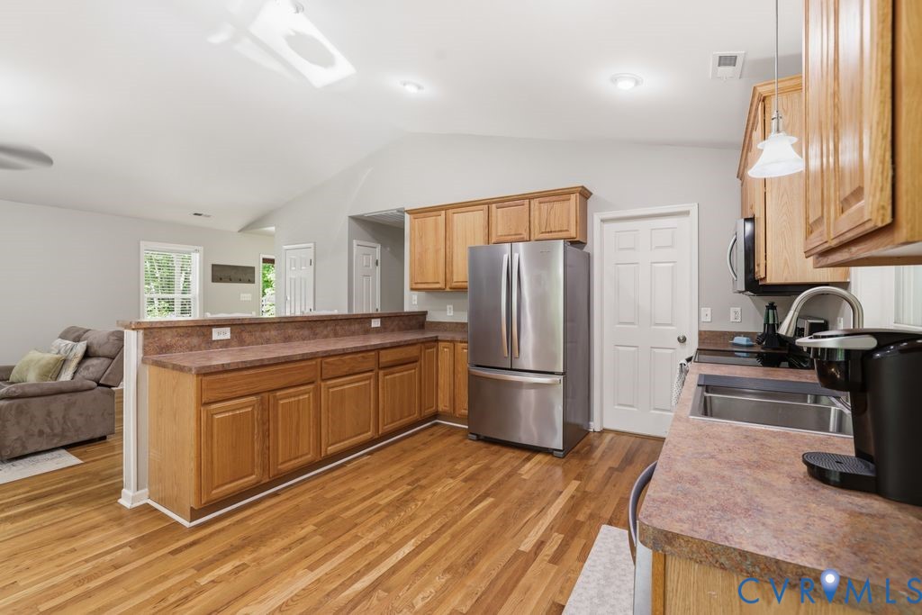 5307 St Pauls Church Road Goochland, VA 23063 - Photo 15 of 44 a kitchen with stainless steel appliances granite countertop a refrigerator a stove a sink and a refrigerator