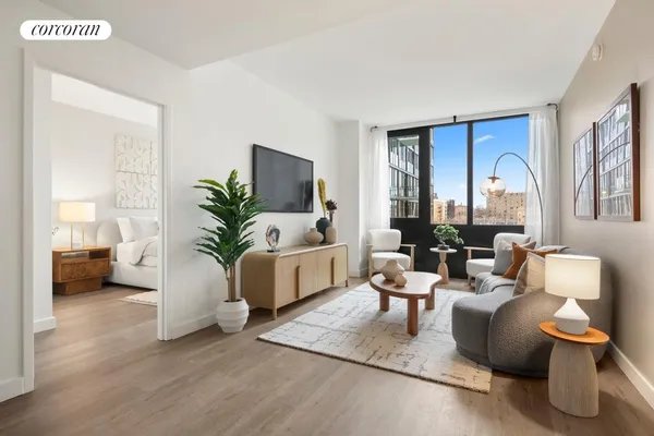 a living room with furniture and a large window