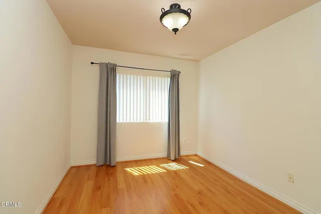 a view of an empty room and window