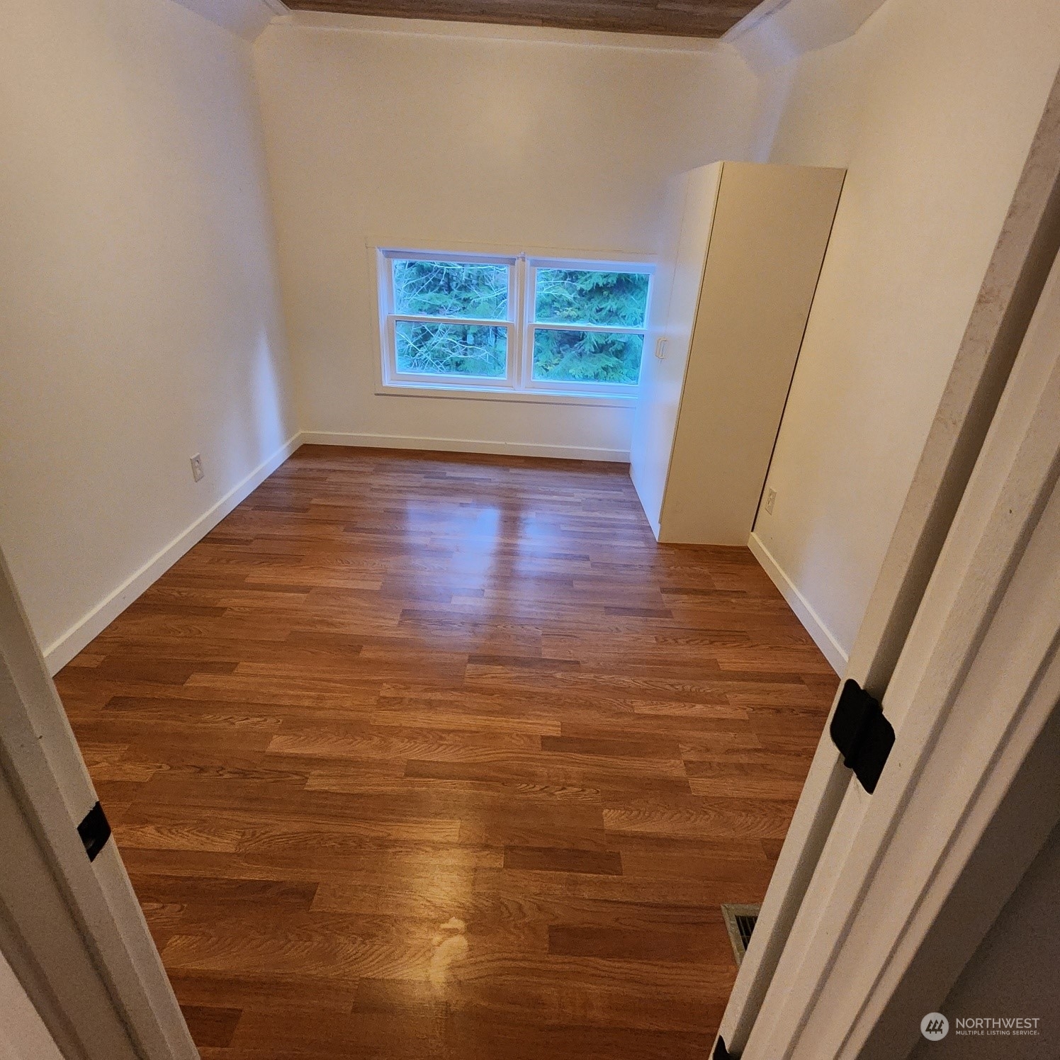 62 Kin Road Naselle, WA 98638 - Photo 14 of 20 a view of an empty room with wooden floor