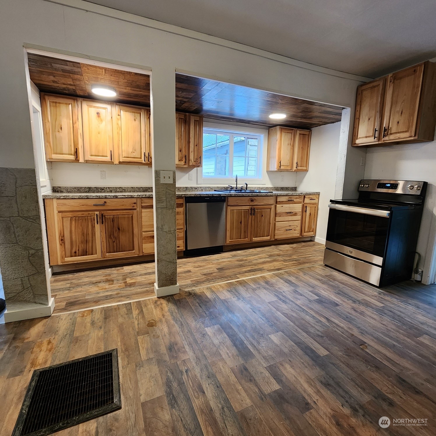 62 Kin Road Naselle, WA 98638 - Photo 3 of 20 a kitchen with stainless steel appliances granite countertop a stove and a sink
