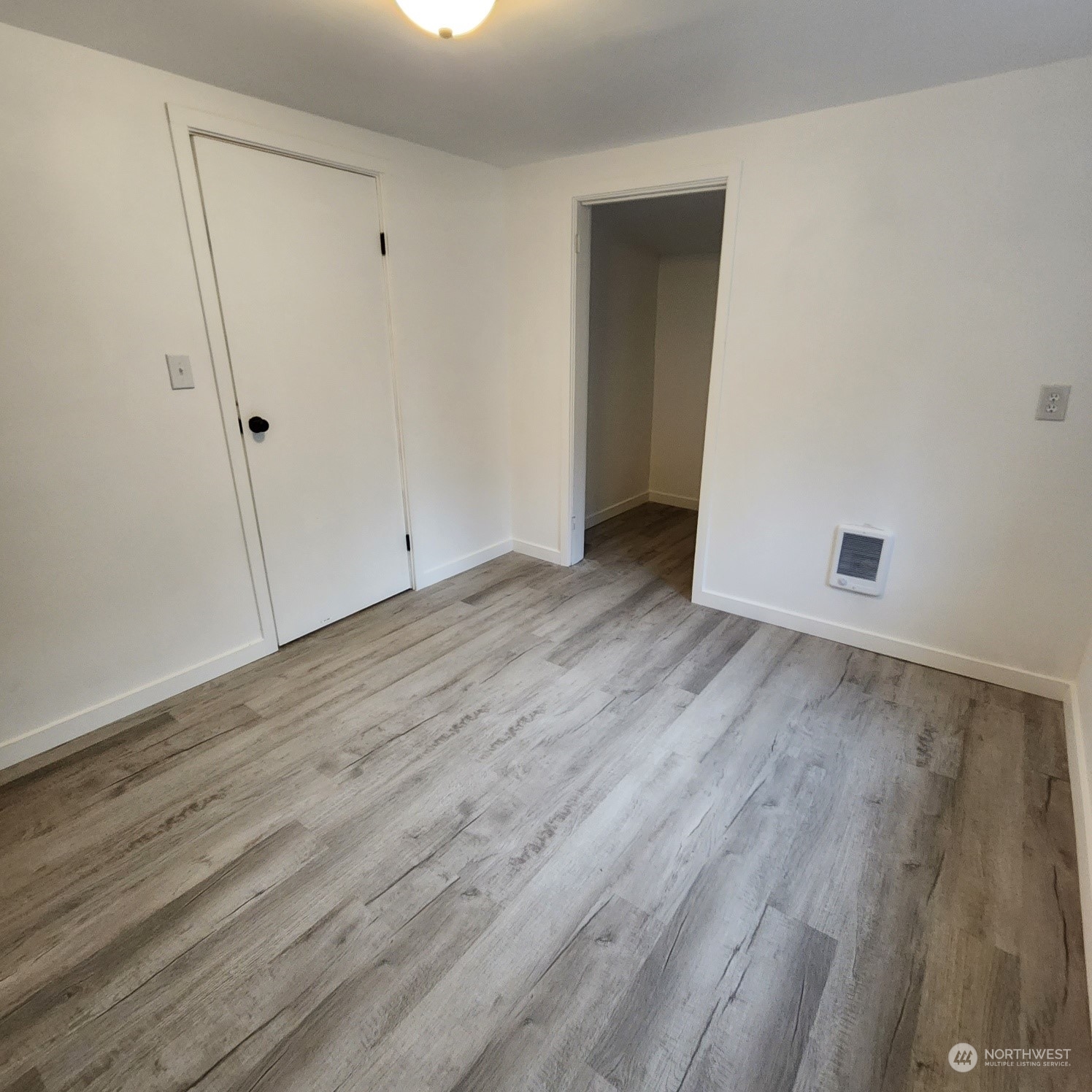 62 Kin Road Naselle, WA 98638 - Photo 8 of 20 a view of an empty room with wooden floor