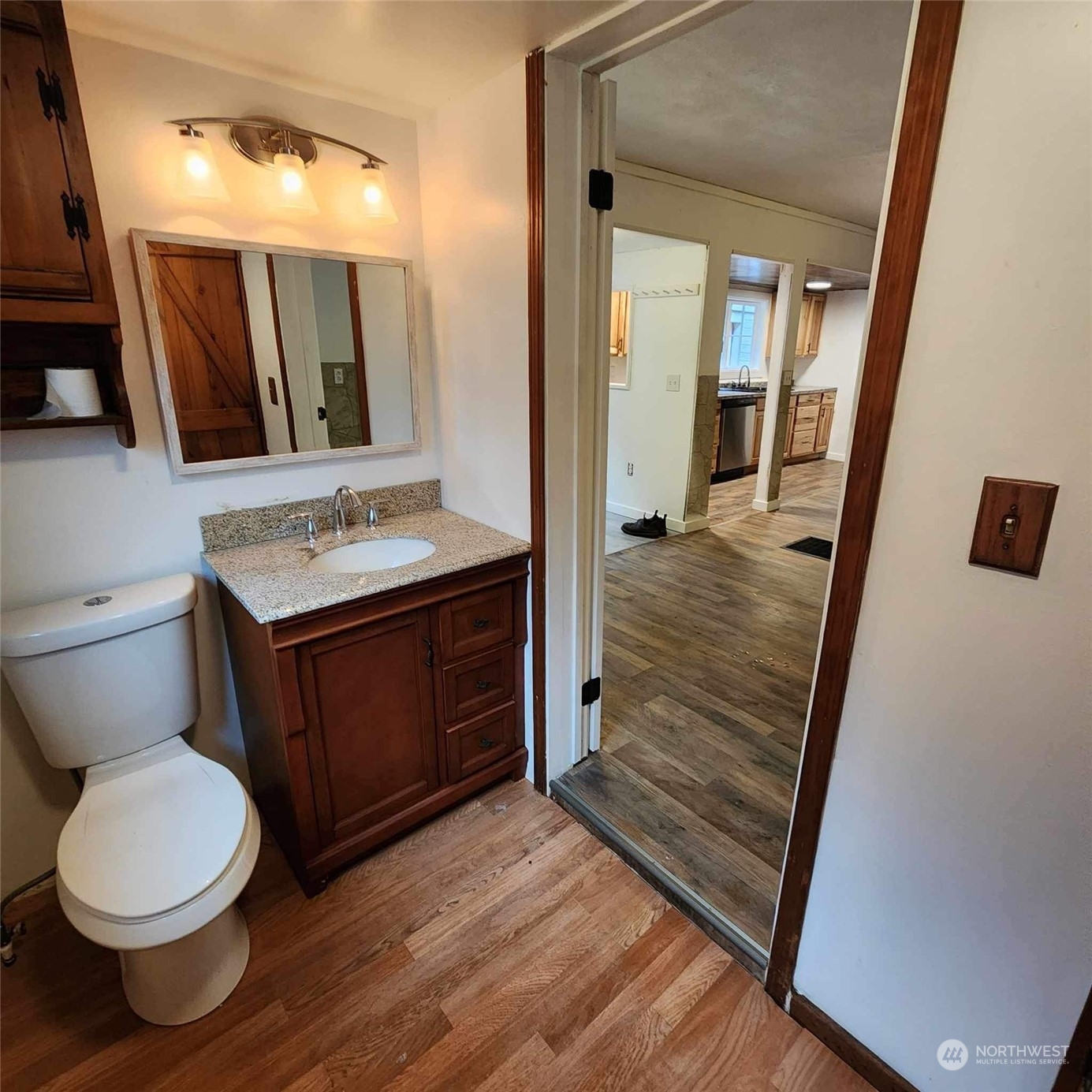 62 Kin Road Naselle, WA 98638 - Photo 10 of 20 a bathroom with a granite countertop toilet sink and mirror