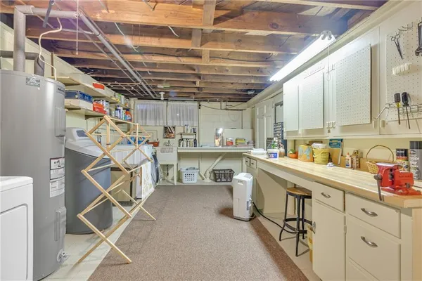 a kitchen with counter top space a sink and cabinets