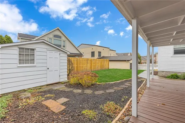a view of a house with a yard and garage