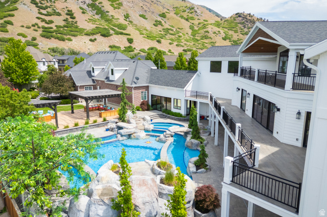 1263 Chapman Court Alpine, UT 84004 - Photo 2 of 83 Combined pool / hot tub with a patio and a pergola