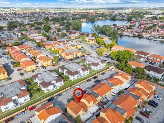 an aerial view of a city with lake
