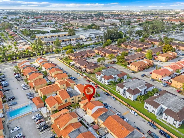 an aerial view of residential building with an outdoor space