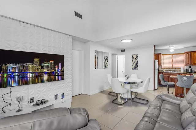 a living room with furniture and white walls