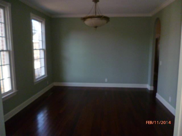 1241 Deal Road Burns, TN 37029 - Photo 4 of 20 a view of an empty room with wooden floor and a window