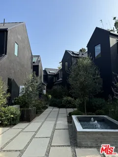 a view of backyard with outdoor seating