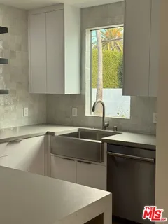 a kitchen with a sink and a window