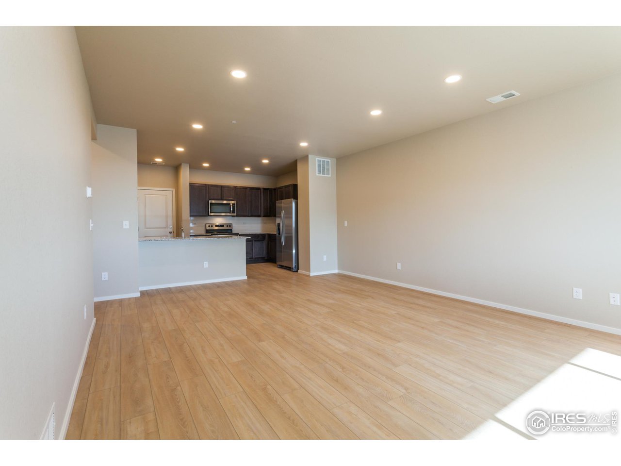 6603 4th St Road, Unit 4 Greeley, CO 80634 - Photo 40 of 40 OPEN FLOOR PLAN W/ VINYL PLANK