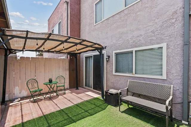 a patio with table and chairs
