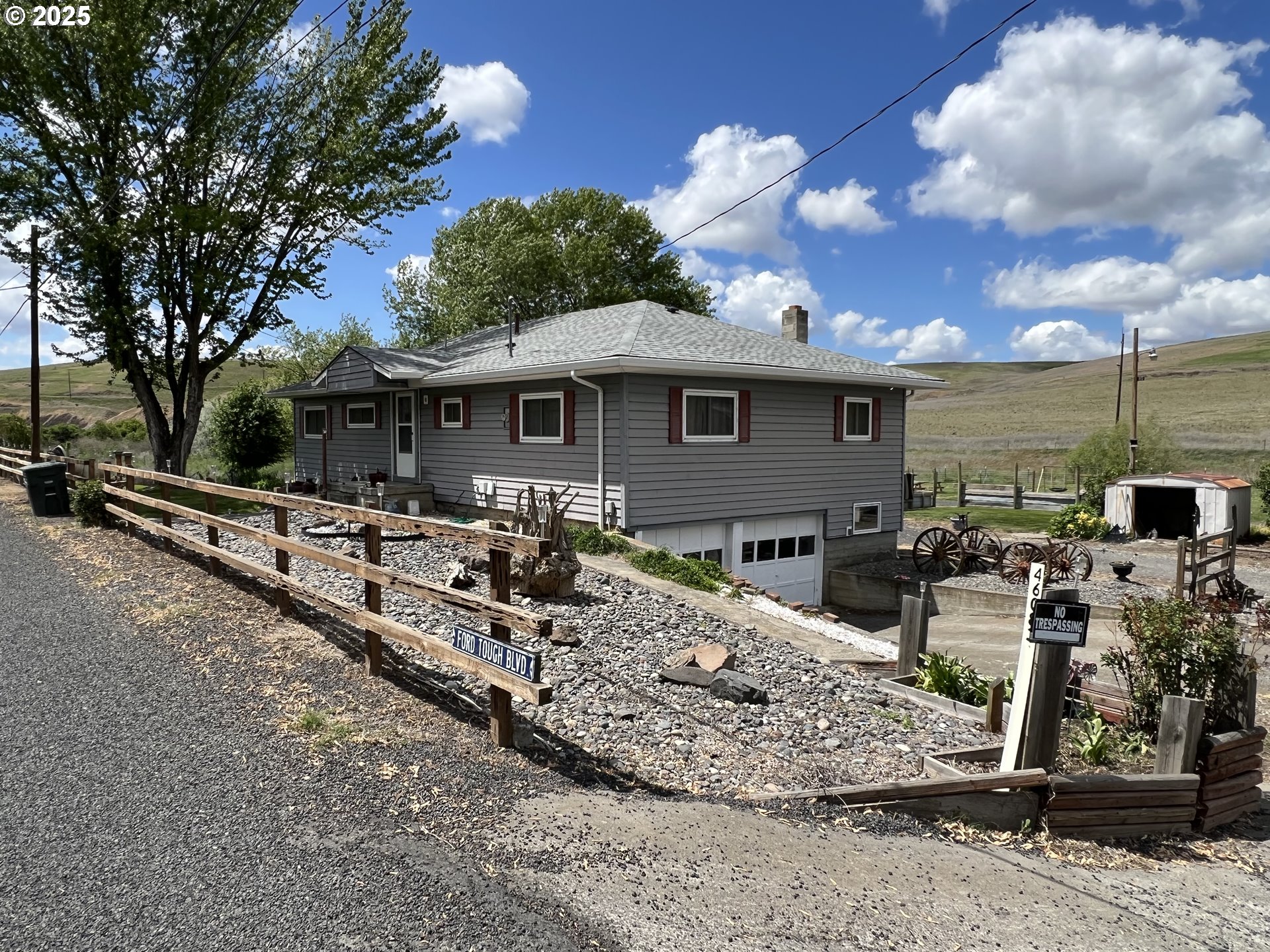 a view of a yard with a patio