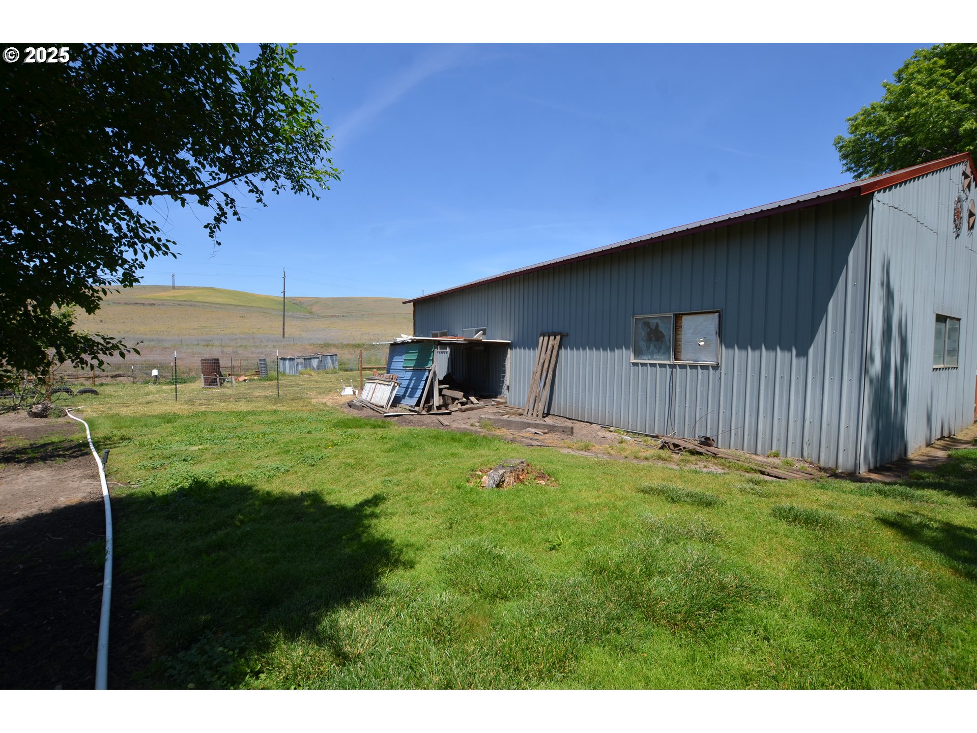 46083 Adams Road Pendleton, OR 97801 - Photo 16 of 47 a backyard of a house with table and chairs