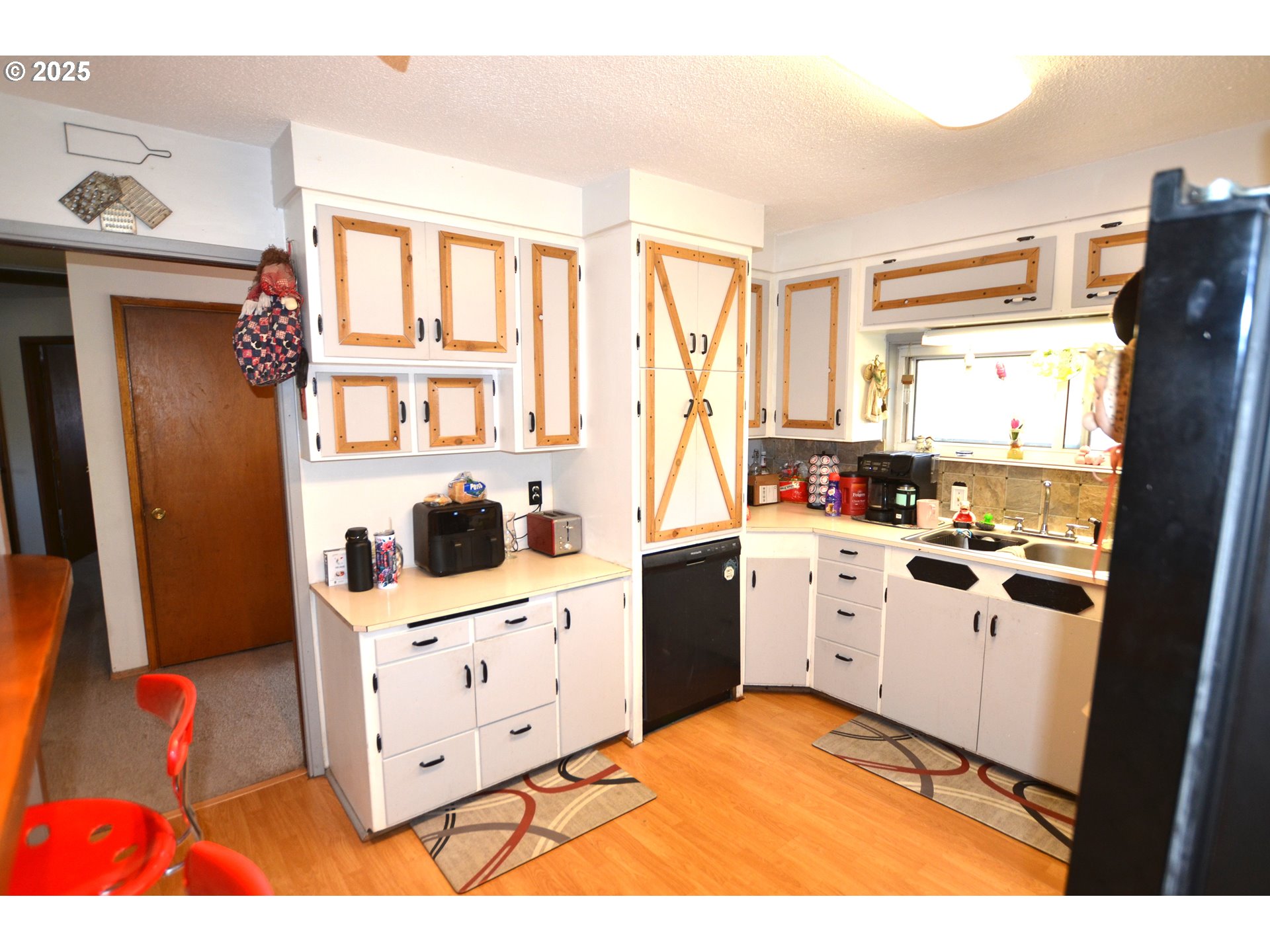46083 Adams Road Pendleton, OR 97801 - Photo 32 of 47 a kitchen with stainless steel appliances kitchen island granite countertop a refrigerator and a stove top oven