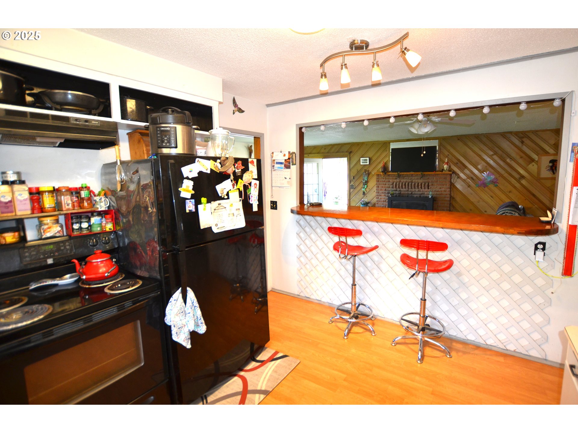 46083 Adams Road Pendleton, OR 97801 - Photo 34 of 47 a kitchen with stainless steel appliances kitchen island granite countertop a refrigerator and stove