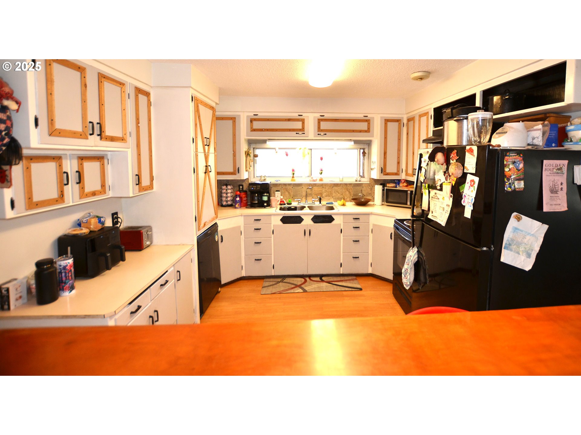 46083 Adams Road Pendleton, OR 97801 - Photo 35 of 47 a kitchen with stainless steel appliances kitchen island granite countertop a sink and cabinets