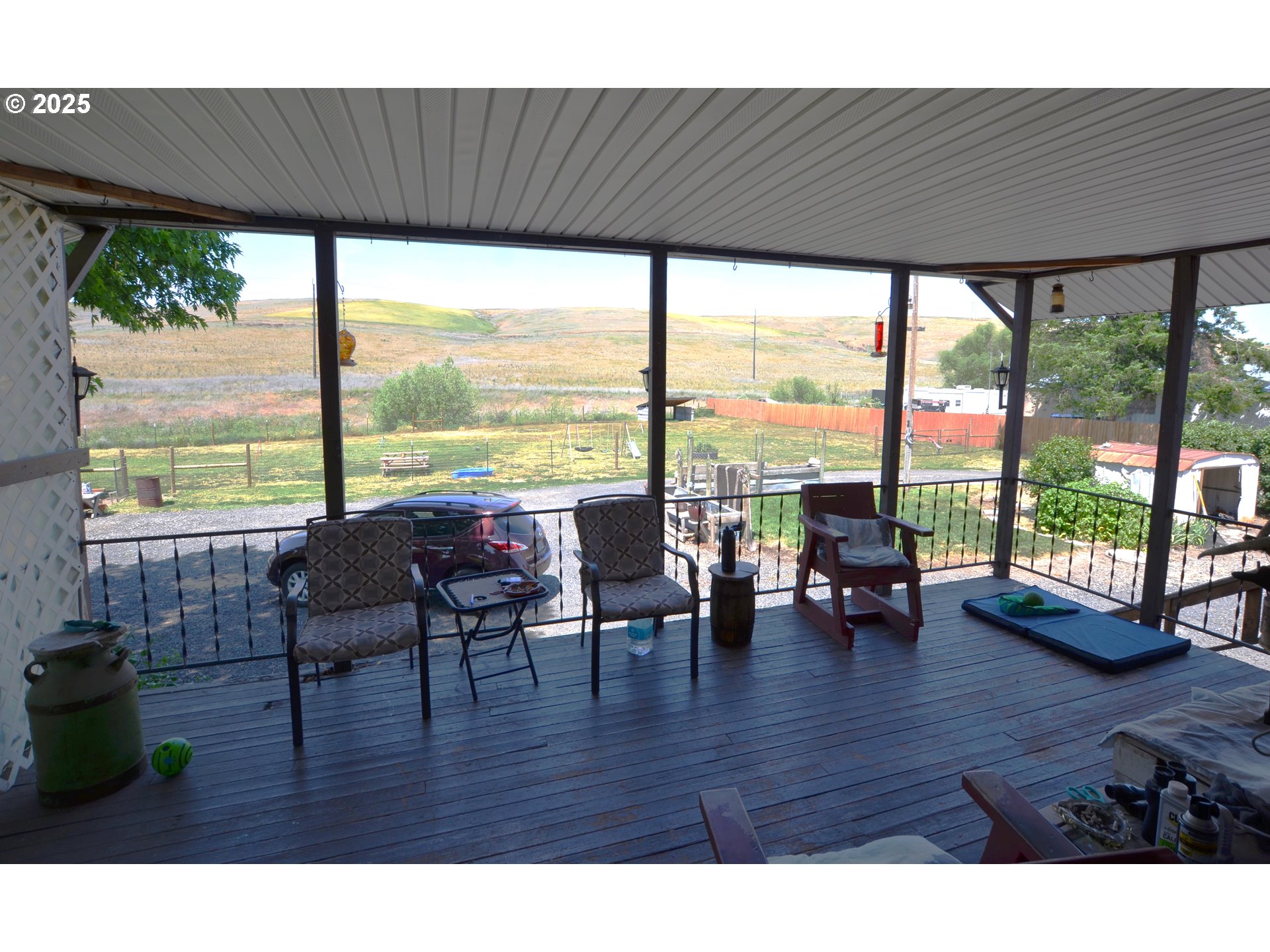 46083 Adams Road Pendleton, OR 97801 - Photo 45 of 47 a living room with furniture and floor to ceiling windows