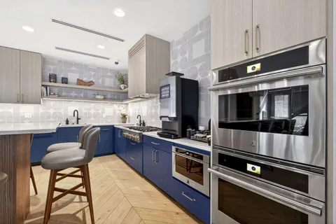 a living room with fireplace furniture and a flat screen tv